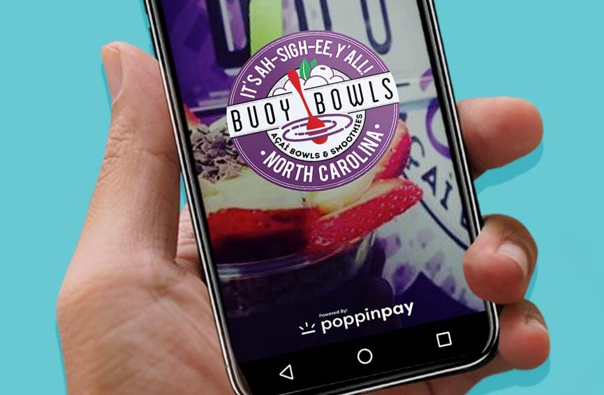 Hand holding iPhone with Buoy Bowls ordering app