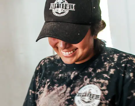 A Buoy Bowls employee smiling and having fun