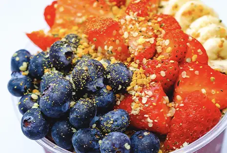 Buoy Bowl açaí bowl with fresh ingredients: strawberries, blueberries, banana and bee pollen