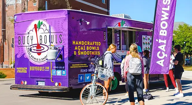 Buoy Bowls food truck with customers around it