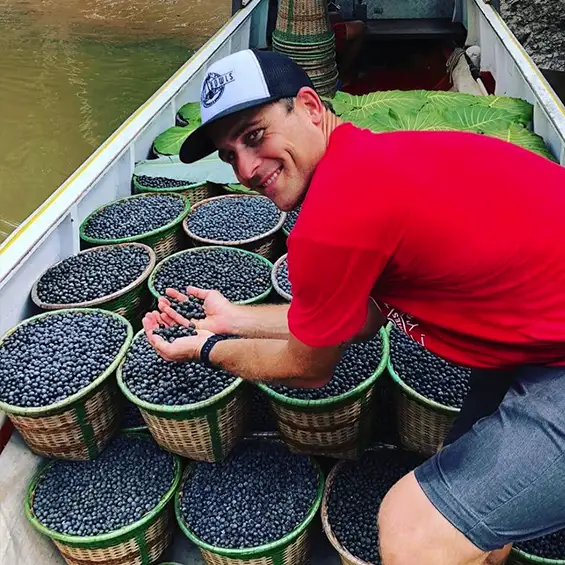 Derek with a boat load of Açaí berries.